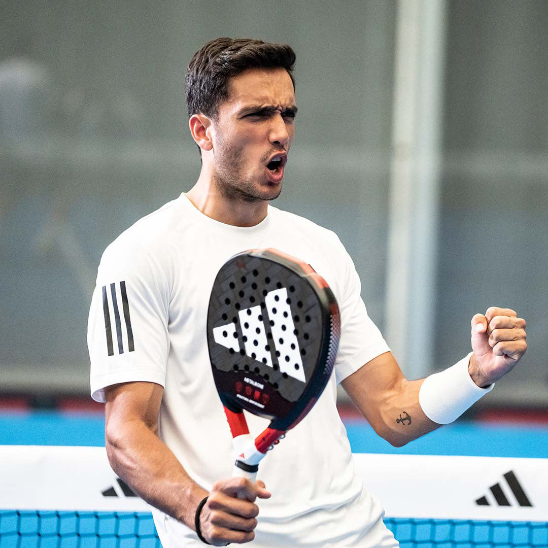 Man celebrates a win playing padel